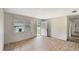 Empty living room with damaged floors and walls, ready for updates at 1013 Carefree Cove Dr, Winter Haven, FL 33881