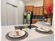 Well-equipped kitchen with quartz countertops, black faucet, and stainless steel refrigerator at 10734 Dawson Lily Way # S, Orlando, FL 32832