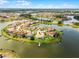 Stunning aerial view of waterfront homes with private docks nestled in a peaceful, upscale community at 1110 Terralago Way, Kissimmee, FL 34746