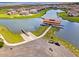 An aerial view shows community boat launch featuring boat slips, a covered pavilion, and access to a large lake at 1110 Terralago Way, Kissimmee, FL 34746
