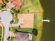 Aerial view of waterfront property showcasing a beautiful home, private dock, and meticulously landscaped grounds at 1110 Terralago Way, Kissimmee, FL 34746