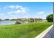 Large waterfront backyard featuring a private dock, creating an ideal setting for lakeside living at 1110 Terralago Way, Kissimmee, FL 34746