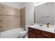 Tidy bathroom featuring a tiled shower, modern sink, and good lighting at 1110 Terralago Way, Kissimmee, FL 34746