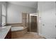 Close-up view of a bathroom featuring dual sinks, a soaking tub and glass enclosed shower at 1110 Terralago Way, Kissimmee, FL 34746