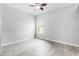 Bright bedroom featuring a ceiling fan, window and grey-toned floor tiles at 1110 Terralago Way, Kissimmee, FL 34746