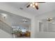Welcoming entryway with stairs, connecting to the living room and kitchen at 1110 Terralago Way, Kissimmee, FL 34746