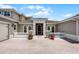 Charming home entrance featuring white columns, arched windows, and lush landscaping at 1110 Terralago Way, Kissimmee, FL 34746