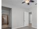 Hallway featuring a view of a glass-enclosed shower and neutral paint at 1110 Terralago Way, Kissimmee, FL 34746