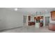 Spacious kitchen features wooden cabinets, stainless steel appliances, an island, and tile flooring at 1110 Terralago Way, Kissimmee, FL 34746