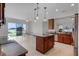 Kitchen showcasing granite counters, stainless steel appliances, a spacious island, and stunning water views at 1110 Terralago Way, Kissimmee, FL 34746