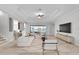 Open-concept living room featuring stylish furnishings, water view, and lots of natural light at 1110 Terralago Way, Kissimmee, FL 34746