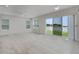 Open living area with tile flooring and large windows offering scenic water views at 1110 Terralago Way, Kissimmee, FL 34746