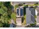 Aerial view of the house showcasing the roof with solar panels, lush greenery, and surrounding neighborhood at 121 Longview Ave, Celebration, FL 34747