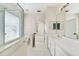 En suite bathroom with long vanity and glass shower at 121 Longview Ave, Celebration, FL 34747