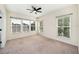 Bedroom featuring three windows, carpet, and ceiling fan at 121 Longview Ave, Celebration, FL 34747