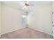 Neutral bedroom with carpet flooring, ceiling fan, window with blinds, and a white trim at 121 Longview Ave, Celebration, FL 34747
