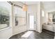 Bright breakfast nook with windows, a view of the backyard, a door to the patio, and hardwood floors at 121 Longview Ave, Celebration, FL 34747
