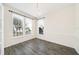 Empty dining room featuring natural light, hardwood floors, modern lighting, and fresh paint at 121 Longview Ave, Celebration, FL 34747