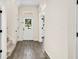 Bright entryway featuring hardwood floors, fresh white paint, and a glass-paneled front door at 121 Longview Ave, Celebration, FL 34747