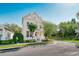 Charming two-story home featuring a covered front porch, landscaped yard, and inviting curb appeal at 121 Longview Ave, Celebration, FL 34747