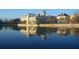 Exterior shot of the town buildings with a lake, and reflective waters at 121 Longview Ave, Celebration, FL 34747