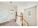 Hallway with railing on stairs leading to bedrooms, a chandelier, and neutral carpet at 121 Longview Ave, Celebration, FL 34747