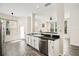 Open kitchen view of the breakfast nook and the kitchen sink with stainless steel appliances at 121 Longview Ave, Celebration, FL 34747