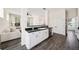 Kitchen featuring an island, stainless steel dishwasher, and a view into the adjacent living room at 121 Longview Ave, Celebration, FL 34747