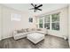 Bright living room featuring wood floors, a ceiling fan, and a large sectional with an ottoman at 121 Longview Ave, Celebration, FL 34747