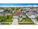 Aerial view showcases home's manicured front yard with palm trees at 12445 Bohannon Blvd, Orlando, FL 32824