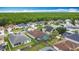 Real estate aerial showcasing a neighborhood with mature trees and well-maintained homes at 12445 Bohannon Blvd, Orlando, FL 32824