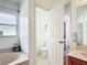 Bathroom featuring a soaking tub beside a separate toilet room, providing privacy and comfort at 12445 Bohannon Blvd, Orlando, FL 32824