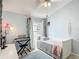 Serene bedroom with soft blue walls, a piano, and delicate decor for a peaceful retreat at 12445 Bohannon Blvd, Orlando, FL 32824