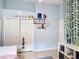 Bright bedroom with blue walls, closet, and shelving for personalized decor at 12445 Bohannon Blvd, Orlando, FL 32824