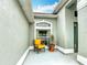 Cozy front porch with seating area perfect for enjoying the outdoors with lots of natural light at 12445 Bohannon Blvd, Orlando, FL 32824