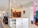 Open kitchen with stainless steel appliances, light countertops, and bar seating area at 12445 Bohannon Blvd, Orlando, FL 32824