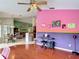 Unique living space with colorful accent walls and hardwood floors at 12445 Bohannon Blvd, Orlando, FL 32824