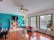 Bright, colorful living room features hardwood floors, pool view, and modern decor at 12445 Bohannon Blvd, Orlando, FL 32824