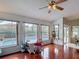 Bright living space overlooking the pool, with hardwood floors and natural light at 12445 Bohannon Blvd, Orlando, FL 32824