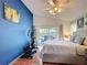 Bright main bedroom featuring a patio door leading to the pool and exercise equipment at 12445 Bohannon Blvd, Orlando, FL 32824
