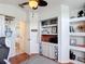 Home office with custom built-ins, shelves and access to an ensuite bathroom at 12445 Bohannon Blvd, Orlando, FL 32824