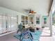 Inviting covered patio with comfortable seating, ceiling fan, and view of the pool at 12445 Bohannon Blvd, Orlando, FL 32824
