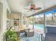 Relaxing covered patio with cushioned seating, ceiling fan, and a view of the pool at 12445 Bohannon Blvd, Orlando, FL 32824