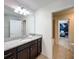 Bathroom with granite counters and view into the themed bedroom, enhancing the home's appeal at 1614 Lima Ave, Kissimmee, FL 34747