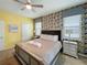 Bedroom with textured wallpaper, a decorative ceiling fan, and luxury bedding at 1614 Lima Ave, Kissimmee, FL 34747