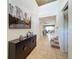 Inviting foyer with high ceilings, tile floors, and a view to the living room and dining area at 1614 Lima Ave, Kissimmee, FL 34747
