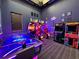 Amusement filled game room with arcade games, an air hockey table and unique decor at 1614 Lima Ave, Kissimmee, FL 34747