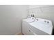 Laundry room with full-sized washer and dryer; white appliance finish at 1614 Lima Ave, Kissimmee, FL 34747