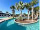 Enjoy a lazy river surrounded by palm trees and lush landscaping at 1614 Lima Ave, Kissimmee, FL 34747
