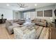 Comfortable living room with sliding glass doors to the patio, tile floors, and decorative artwork at 1614 Lima Ave, Kissimmee, FL 34747